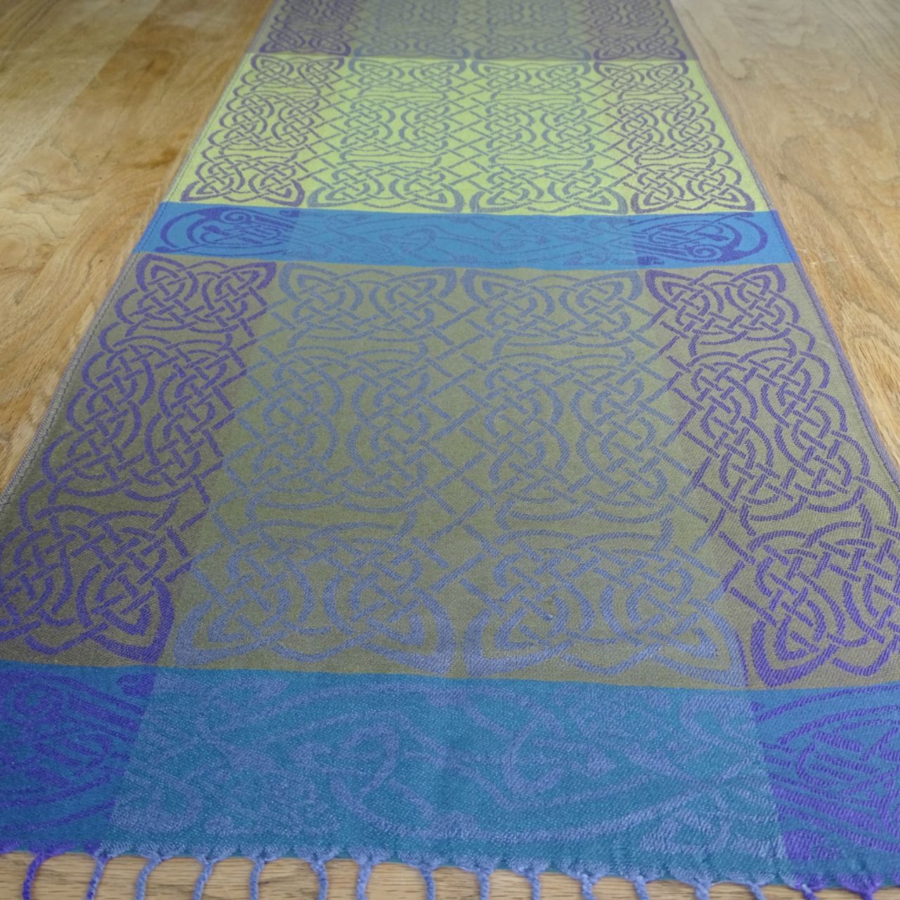 Mulligans Ireland Rathlin Celtic Pashmina Scarf Rathlin Island lies off the north coast of Antrim near the ‘Giants Causeway’. Local legend tells of the ‘Children of Lir’ King Lir had four children one girl, Fionnuala, and three sons, Aodh and twins, Fiachra and Conn.