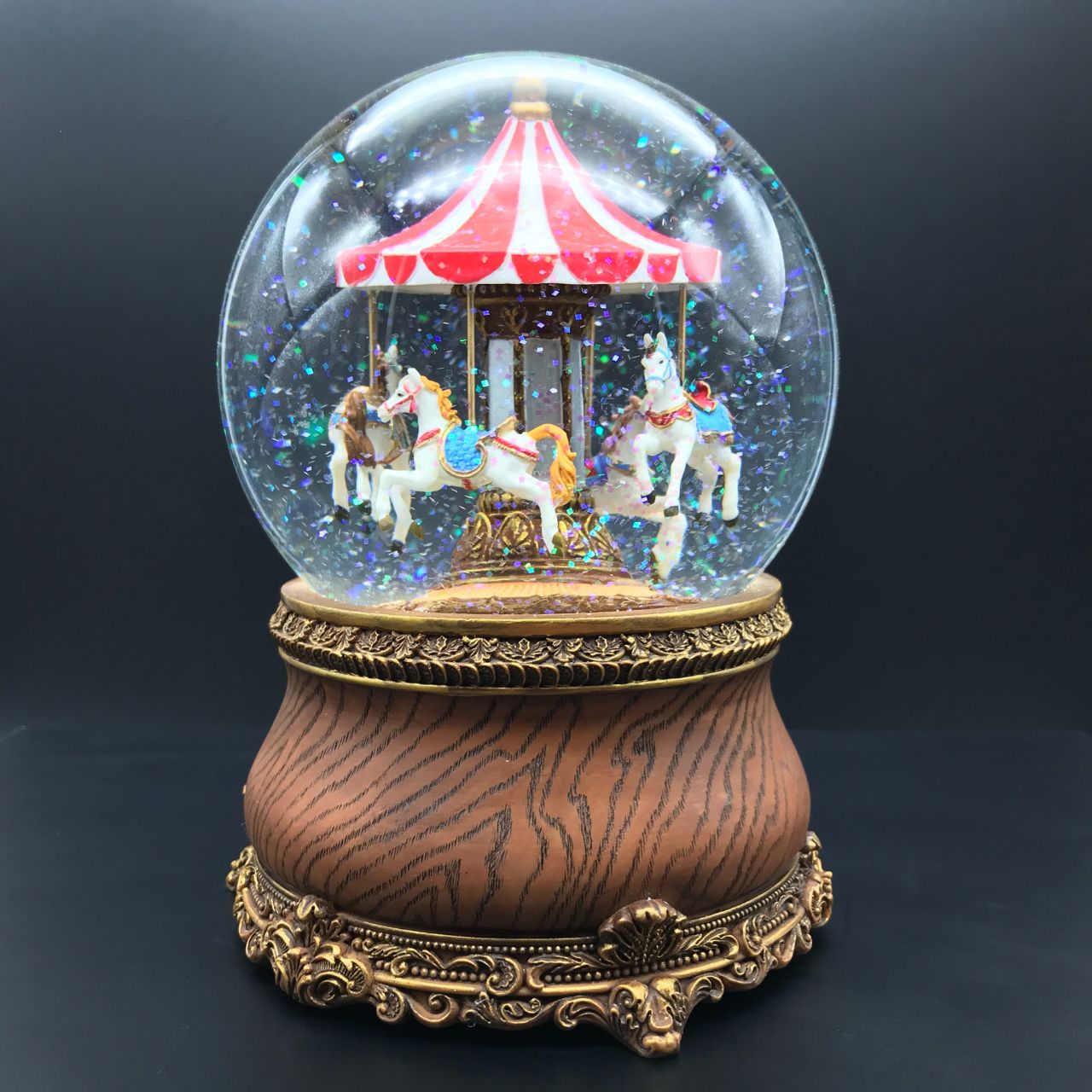 Music box World Snow Globe Carousel Snow globe is a beautiful Christmas decoration that is treasured by people of all ages that captures the the magical moments of Christmas. The carousel in the globe turns to the melody “Oh Christmas Tree”