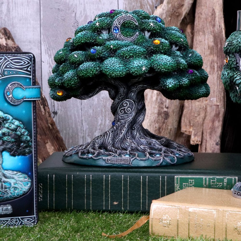 Nemesis Now Tree of Life Figurine A symbol of longevity, wisdom and rebirth, our tree of life proudly stands under the light of the moon, filtering its Spiritual energy. Its silvery roots form intricate networks throughout the earth, connecting the human race in love, peace and harmony.