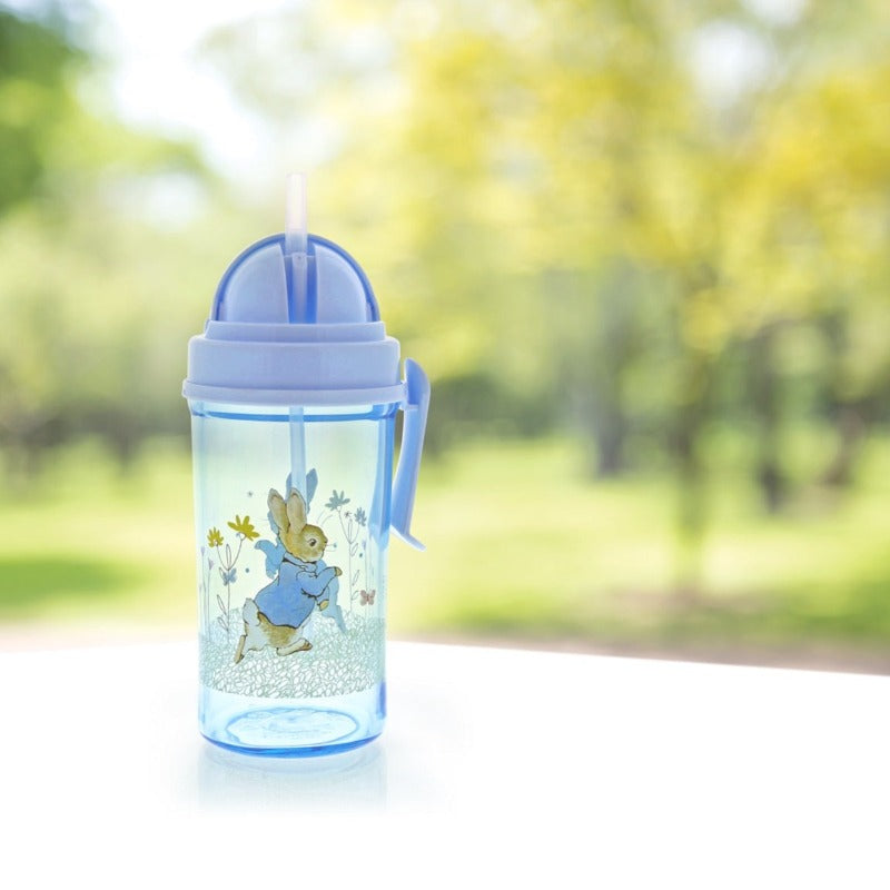 Beatrix Potter Peter Rabbit Water Bottle This handy Peter Rabbit Water Bottle is great for on the go or school. With a small handle for easy holding and a pop-up straw it is ideal for school lunch boxes, picnics or daytrips with the family.