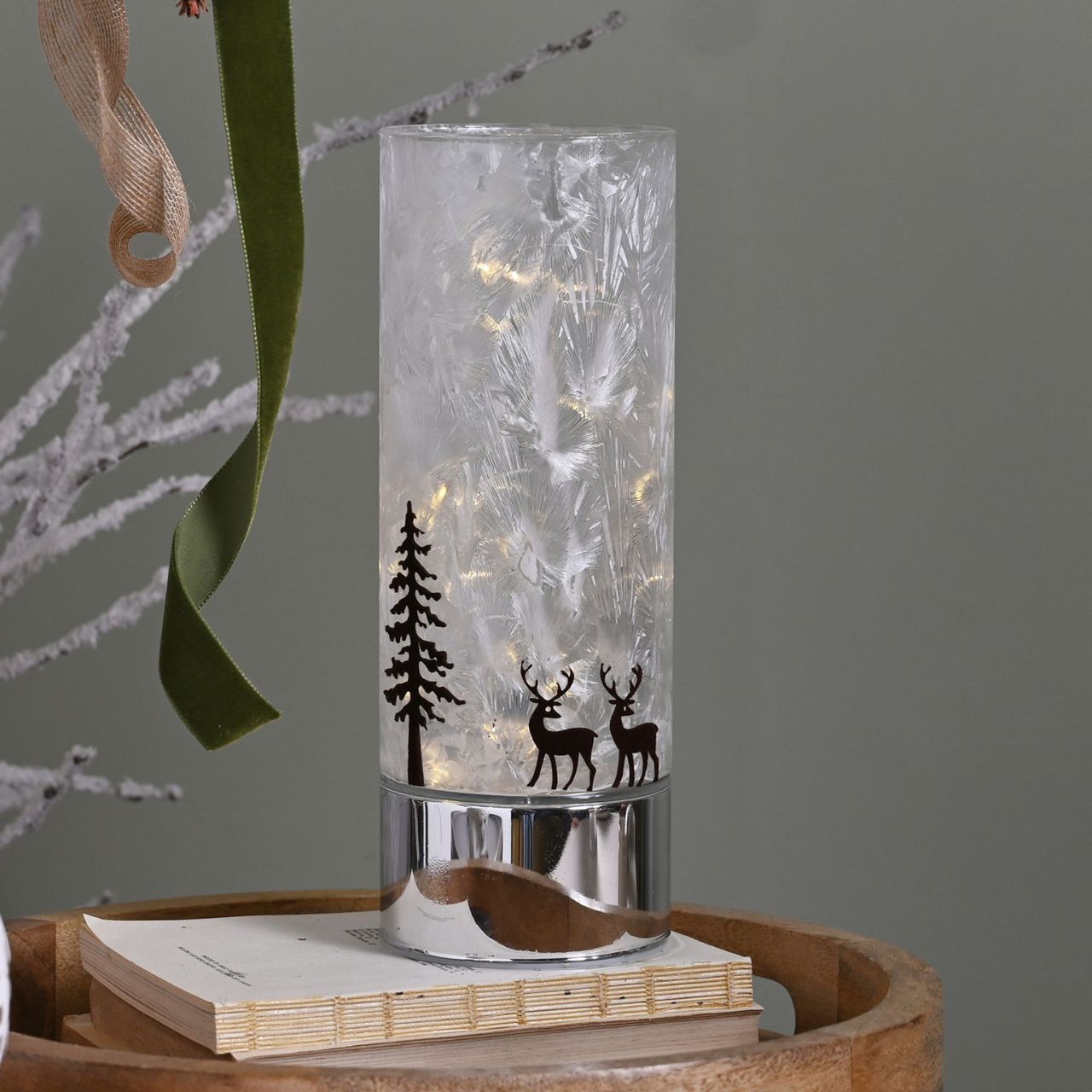 Medium Reindeer with Tree Christmas LED Light Tube A medium reindeer with tree LED light tube. This illuminating decoration is a delightful twist on the traditional this Christmas.