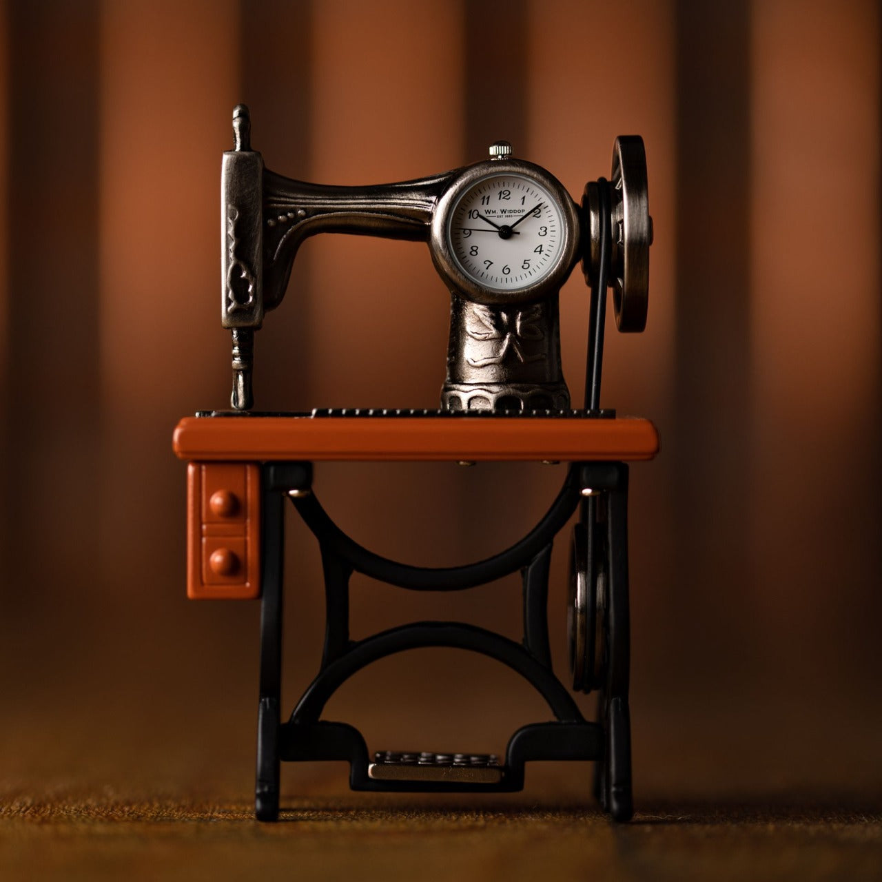 Miniature Clock - Sewing Machine Bring a uniquely refreshing touch to the home with this stylish miniature clock made with great attention to detail.