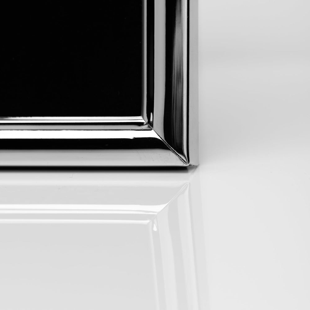 Impressions Silver-plated Photo Frame with Bevel Edge 4" x 6" Give a special photo the perfect place to shine with this elegant slim bevelled edge silver plated photo frame. From IMPRESSIONS - helping your photos speak their thousands words.