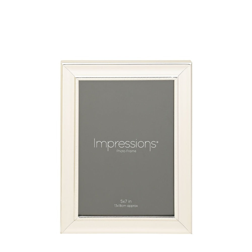 Impressions Silver-Plated Single Beaded Photo Frame 5" x 7" An elegant silver plated photo frame with scalloped edge and beaded aperture border. From IMPRESSIONS® - let your photos speak their thousands words.