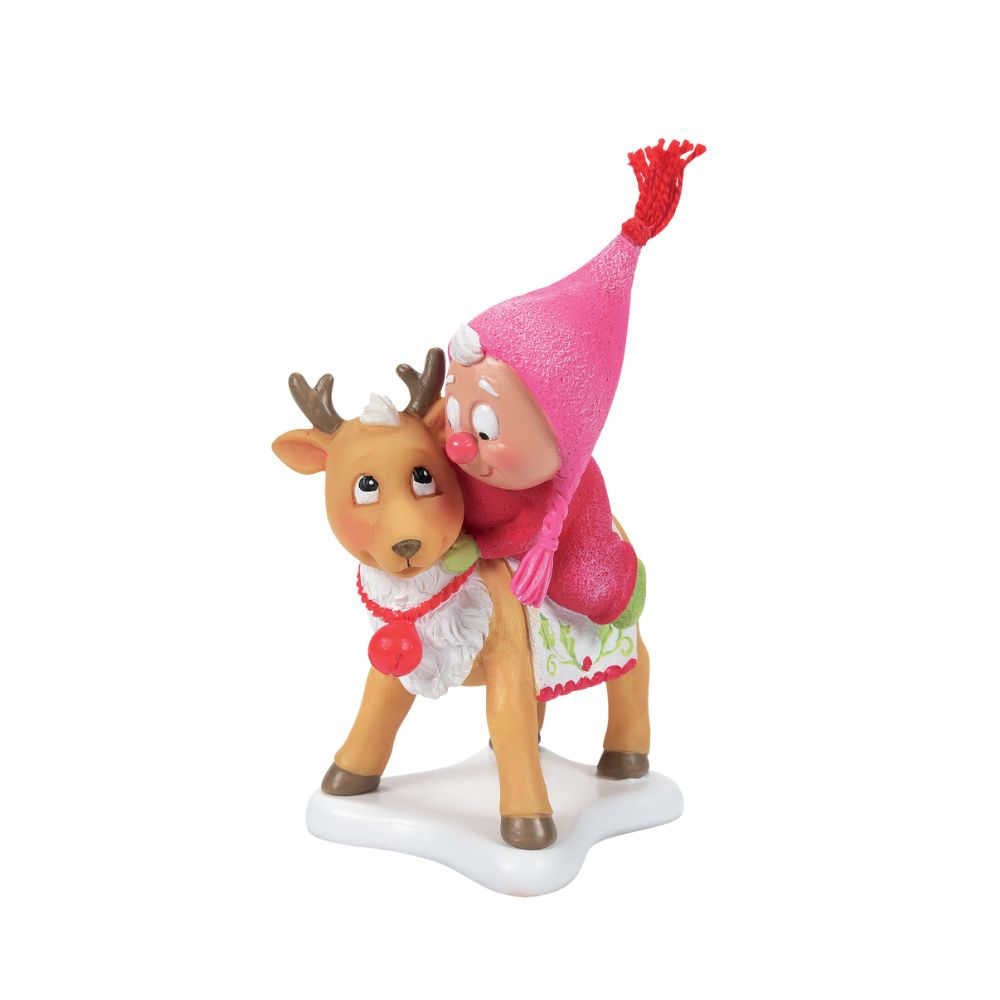 Department 56 Snowpinions Christmas Snow Gnome on Deer This cute Snow Gnome is hanging out with his Reindeer friend. Hand crafted from high quality cast stone, they have been hand painted by our in-house artists to ensure a high level of detail. This Snow Gnome even has a real tassel atop his pink hat. This is the perfect festive gift or accessory.