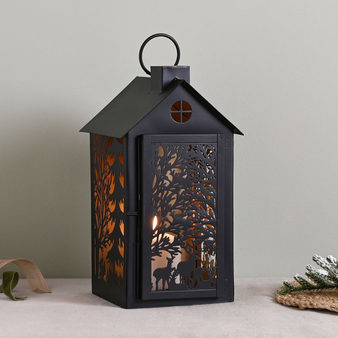 Stag Silhouette House Christmas Lantern Medium A medium stag house silhouette lantern. This enchanting lantern glistens with festive charm throughout the Christmas period.