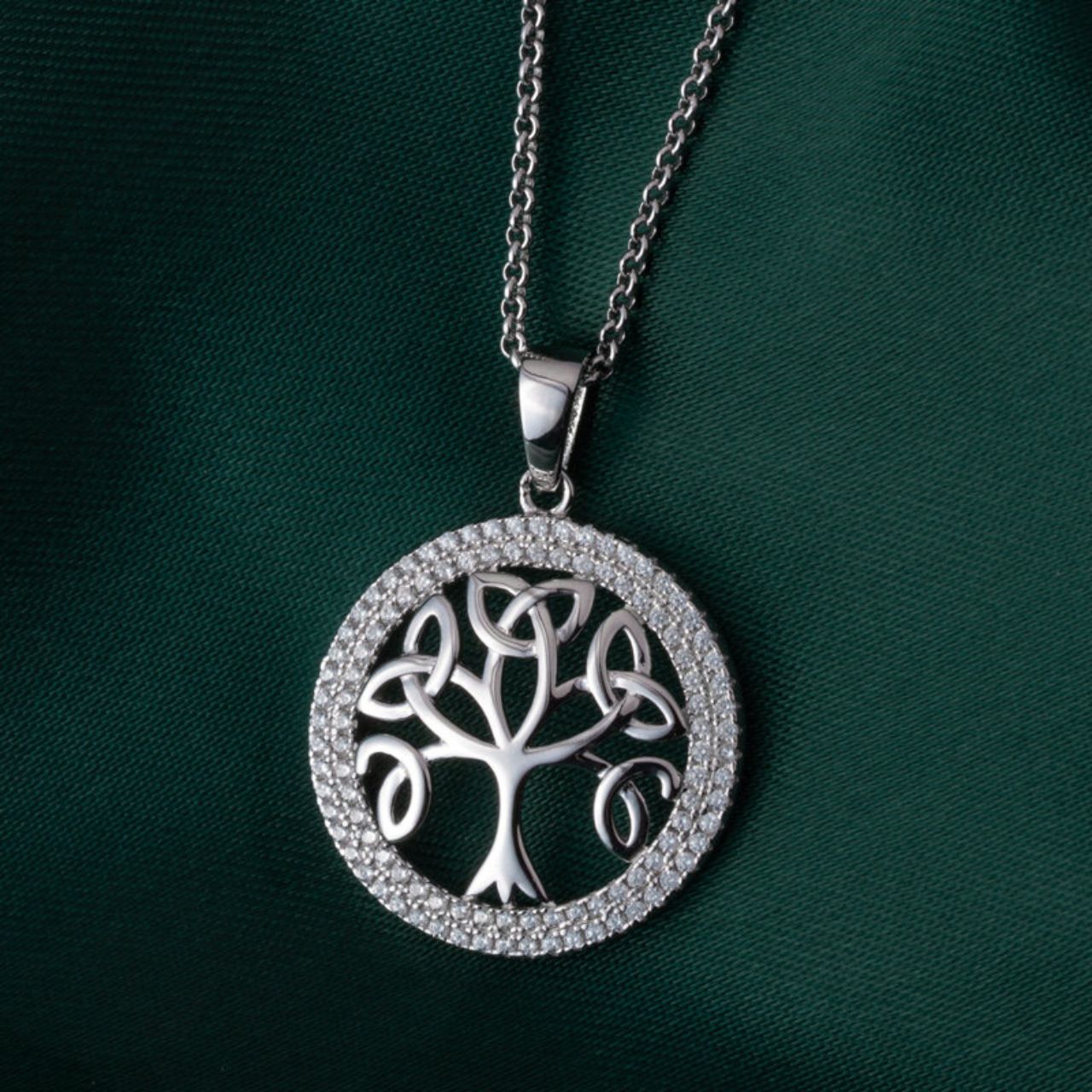 Sterling Silver Cubic Zirconia Tree of Life Necklace The Tree of Life on this sterling silver pendant dates back to the ancient Celts who believed that trees were the source of all life. Today, the Tree of Life symbolises the Celtic family tree, with the roots representing the beginning of the family, and the outer ring of this sterling silver pendant signifying the circle of the family.