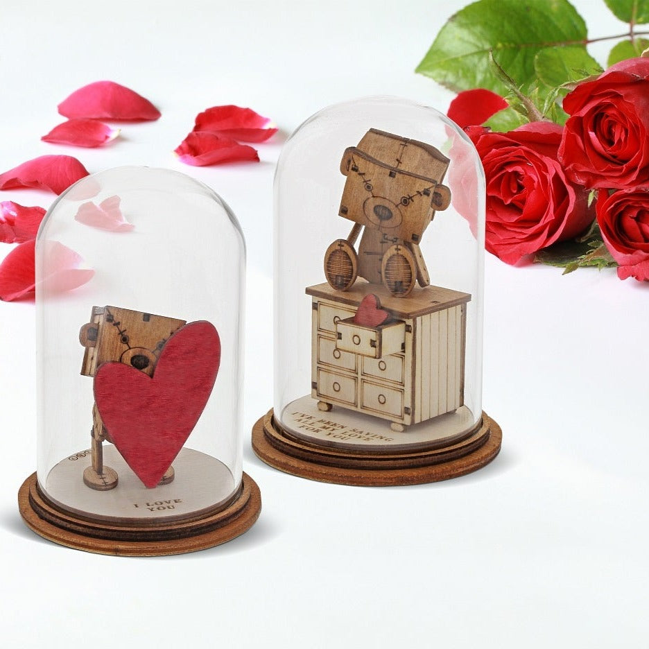 The Little Wooden Bear - I Love You Figurine The Little Wooden Bear. This little bear will make you smile, with sentiments to suit every occasion. This glass dome decoration encases our favourite little bear, adorned a giant red love heart, ready for the one he loves.