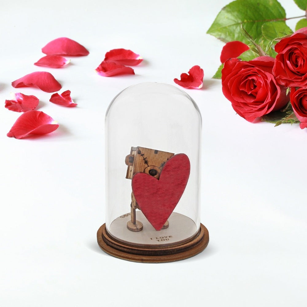 The Little Wooden Bear - I Love You Figurine The Little Wooden Bear. This little bear will make you smile, with sentiments to suit every occasion. This glass dome decoration encases our favourite little bear, adorned a giant red love heart, ready for the one he loves.