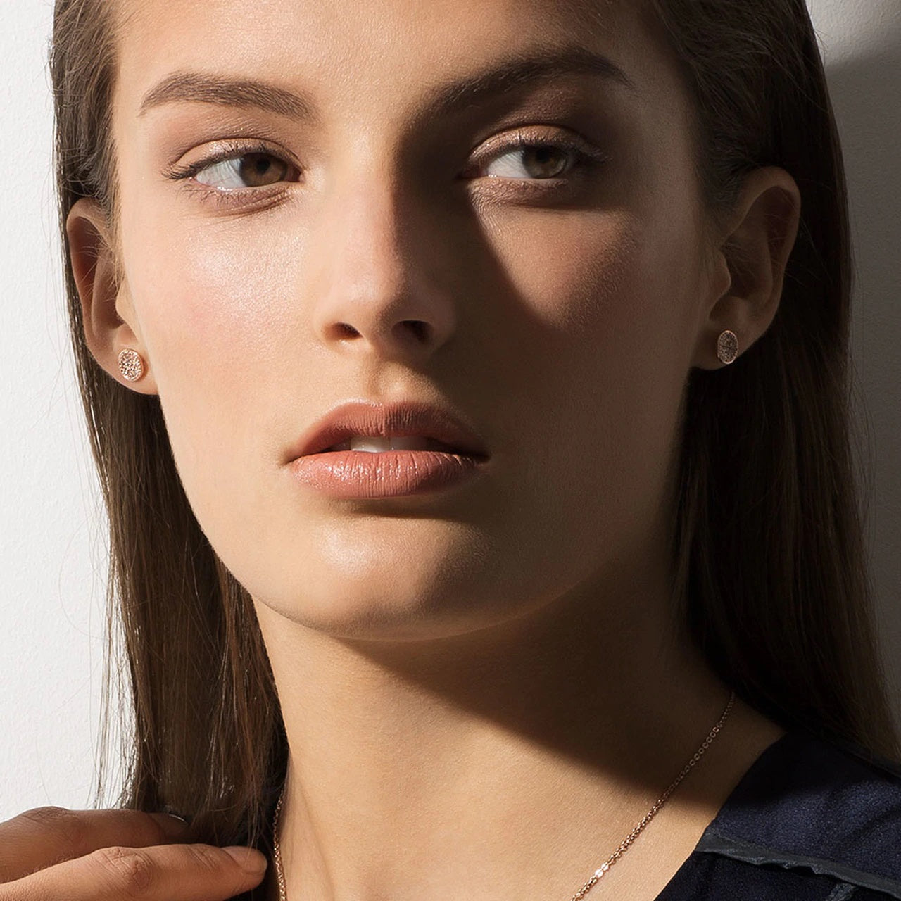 Tipperary Crystal Pave Full Moon Earrings Rose Gold Dainty and dazzling, these earrings are a mini version of our pavé moon pendant. Full of sparkle, these adorable rose gold earrings are covered in round micro-set clear crystals. They secure comfortably with push back closures.