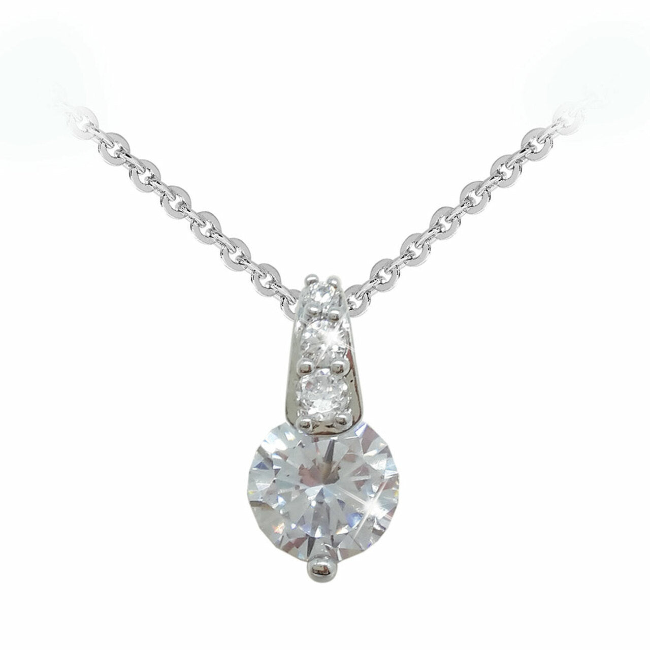 Tipperary Crystal Silver Round Stone Pendant With Pave Bale Simple, yet captivating, this stunning pendant will complement any look. Crafted in cool silver, the pendant showcases a single luminous centre stone in a unique single prong setting. Above, a trio of beautiful clear, round crystals line the polished linear bale.