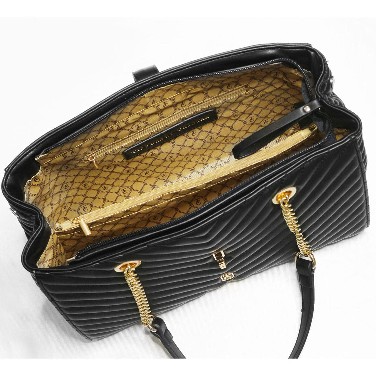 Tipperary Crystal Versailles Shoulder Bag Black - Yellow Gold Hardware Rendered in a chevron stitching, the Versailles Handbag is a complete luxury. The contrast of the yellow gold-toned chain straps against the soft luxurious chevron quilting makes for an effortlessly chic accessory that will bring you from day to night with ease.