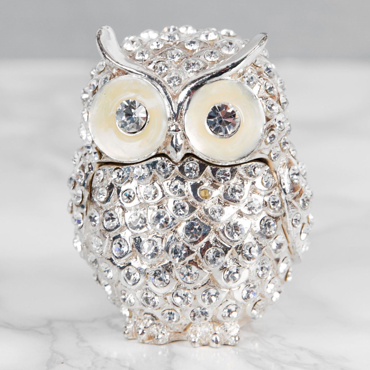 Treasured Trinkets - Crystal Owl A stunning crystal encrusted owl trinket box from Treasured Trinkets. This exquisite trinket box is a wonderful ornament to complement a mantelpiece, bookcase or cabinet.