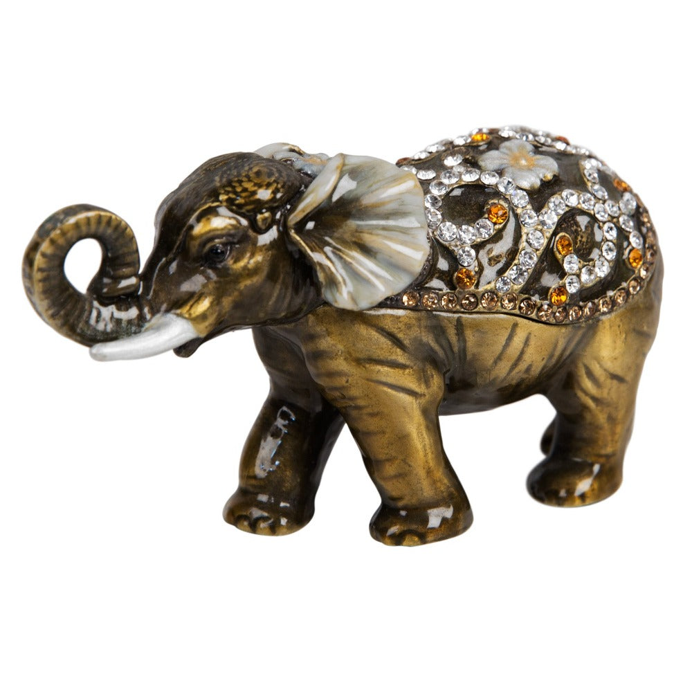 Treasured Trinkets - Elephant Curled Trunk A beautiful, hand painted and crystal finished elephant trinket box from Treasured Trinkets. Decorated with crystal patterns and floral embellishments, this colourful trinket box is a wonderful ornament to complement a mantelpiece, bookcase or cabine