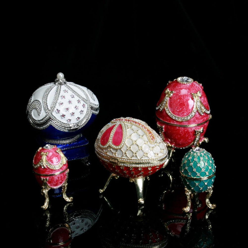 Treasured Trinkets - Large Red Fabergé Egg A beautiful, hand painted and crystal finished Fabergé egg trinket box from Treasured Trinkets. Painted in a majestic red colour with stunning gold and crystal patterns, this trinket box is a wonderful ornament to complement a mantelpiece, bookcase or cabinet.