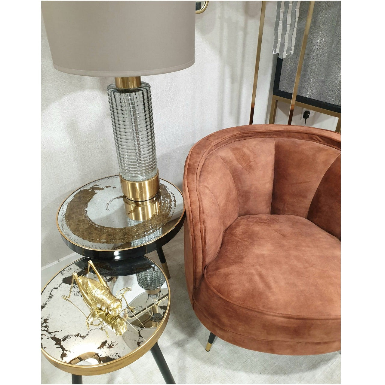 Mindy Brownes Vega Side Table Black painted leg with gold tip and surround, 37cm diameter side table, mirrored top with distressed grey swirl patterned top. Can be styled solo or as part of a collaboration with the Palm, Bellatrix & Venus side tables for the ultimate styling effect.