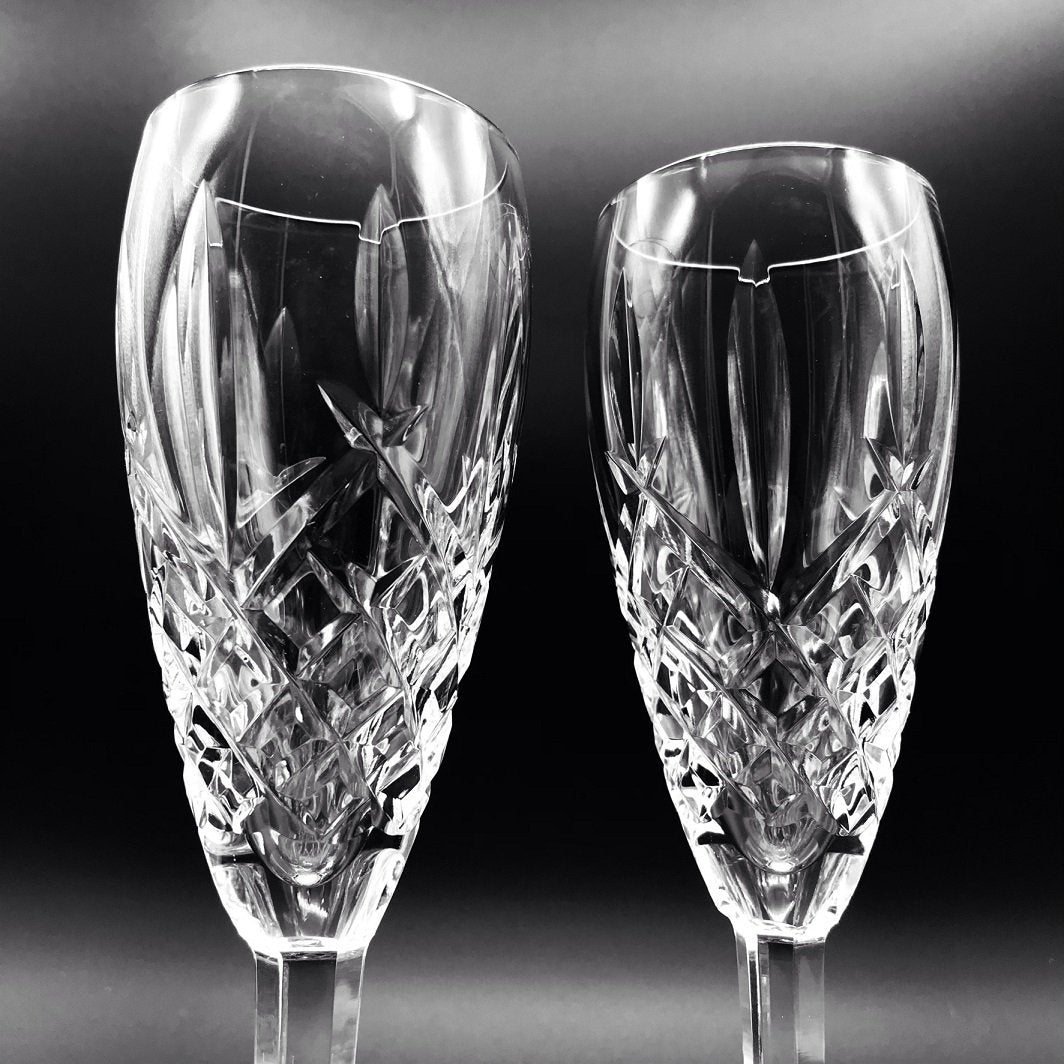 Waterford Crystal Araglin Flute Champagne Pair The Araglin Collection by Waterford is characterized by diamond and vertical wedge cuts and an elegant tulip design, creating stunning crystal and stemware with a truly unsurpassed shine and brilliance.