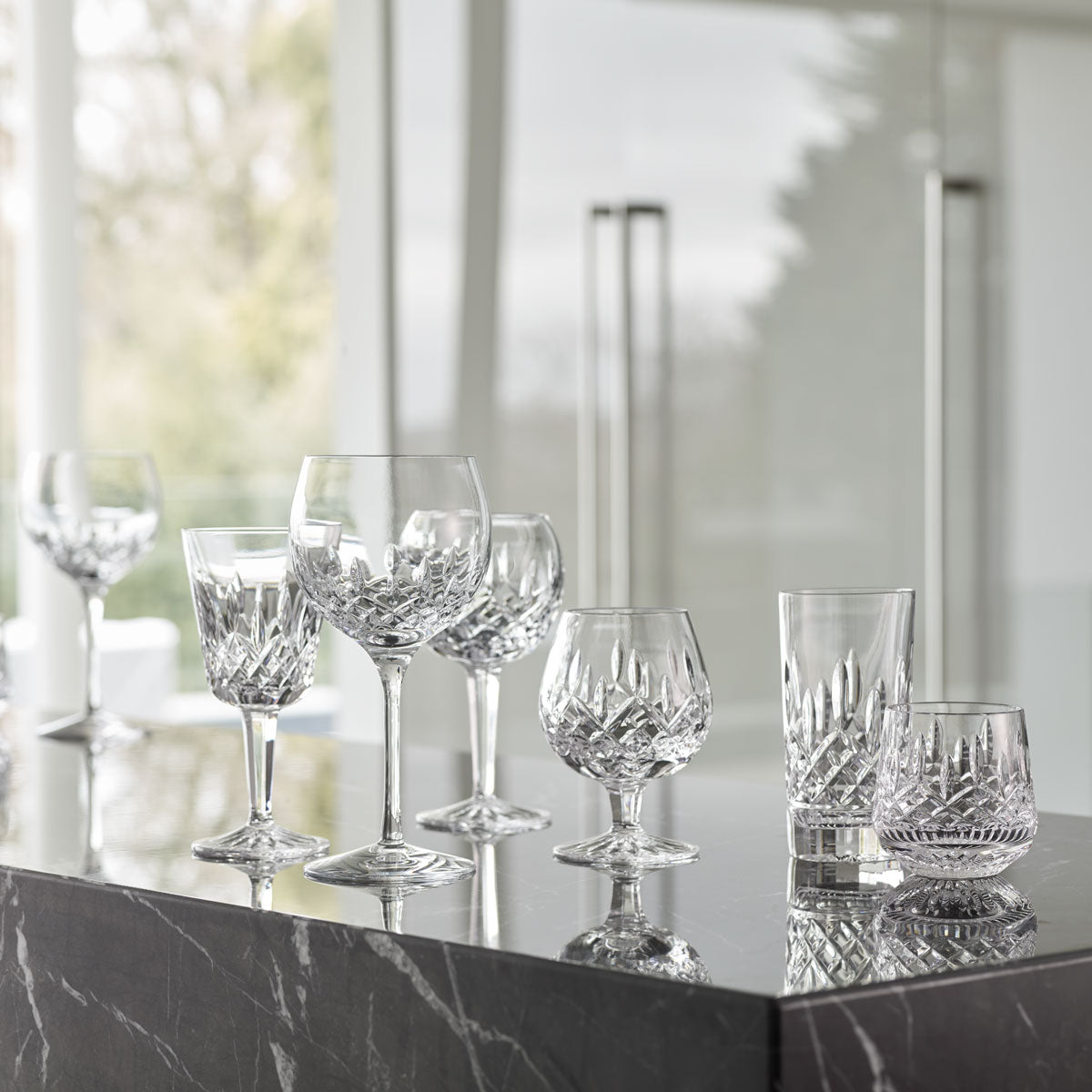 Waterford Crystal Lismore Whiskey Glass Set of 4  The Waterford Lismore pattern is a stunning combination of brilliance and clarity. You could honor Lismore's Irish roots serving drams in these Lismore Old Fashioned glasses, or use them to serve spirits 'on the rocks.'