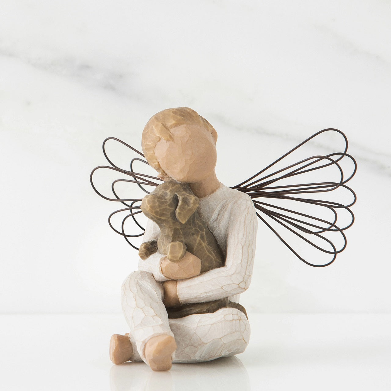 Willow Tree Angel of Comfort A gift to express sympathy, comfort, remembrance and healing. A sweet little boy angel, hugging his best friend. Angel of Comfort is the only boy figure with wings.
