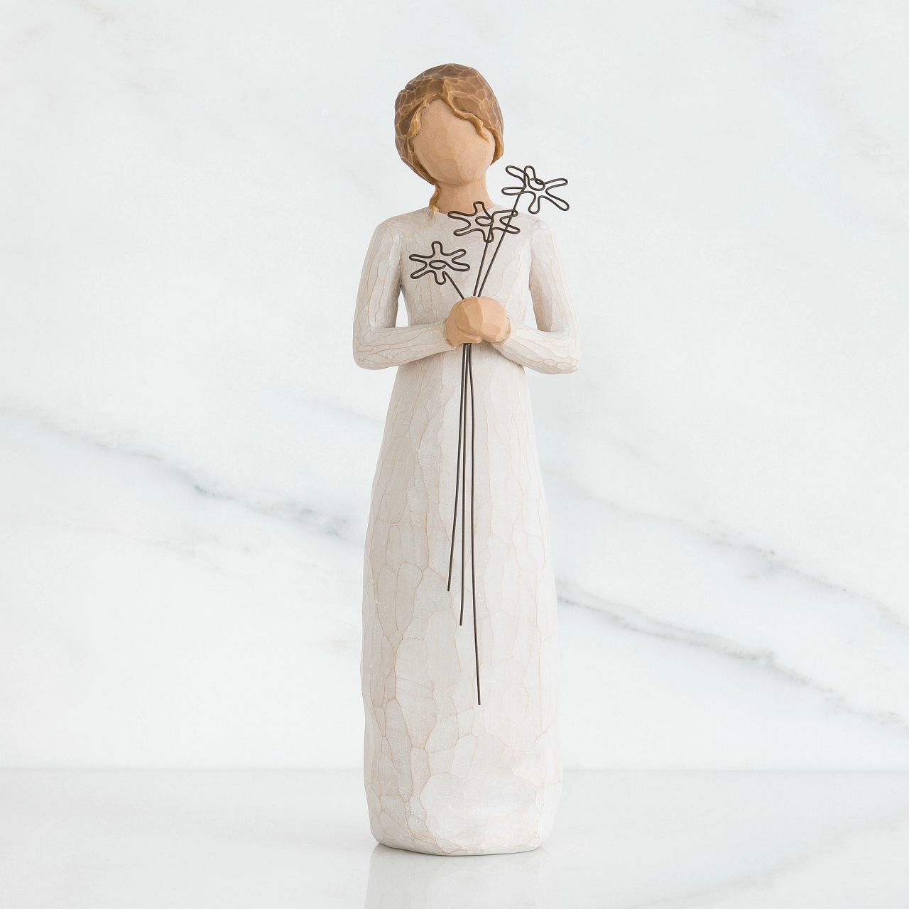Grateful by Willow Tree Willow Tree is an intimate line of figurative sculptures representing sentiments of love, closeness, healing, courage, hope...all the emotions we encounter in life. Artist Susan Lordi hand carves the original of each Willow Tree sculpture. Pieces are made in cast stone from her original carvings, and then individually painted by hand with lead-free paint.