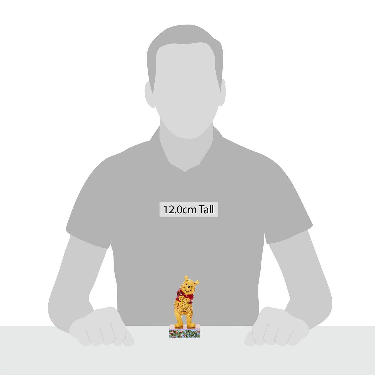 Jim Shore Beloved Bear Winnie the Pooh Personality Pose Figurine Celebrating the 95th anniversary of the Winnie the Pooh book, this Silly Ol' Bear is happily smiling with his belly full of honey. Jim Shore's design captures the personality of the beloved Winnie the Pooh from the Hundred Acre Wood.