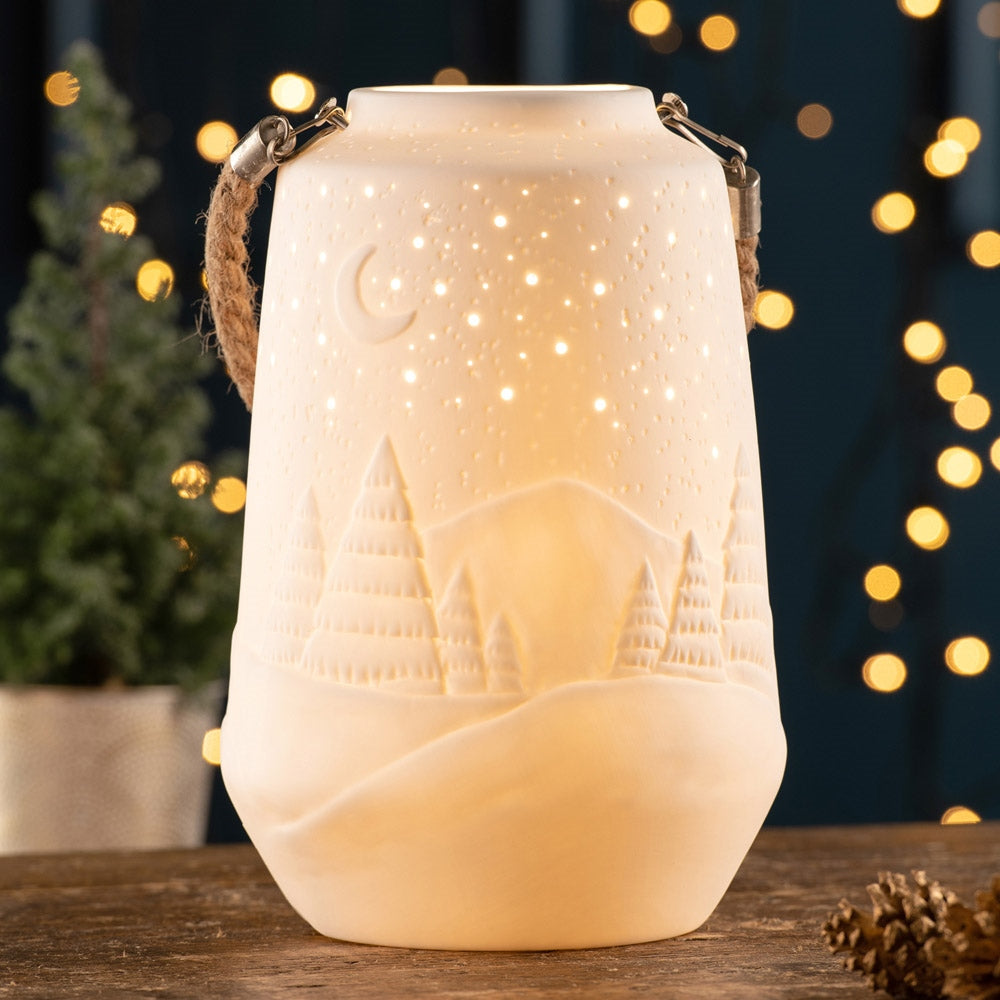 Winter Scene Luminaire by Belleek Living Create a Winter Scene with this beautiful rope handled Winter Scene Luminaire. When lit the luminaire creates soft mood lighting to ensure a relaxed and peaceful atmosphere and displays a gorgeous winter starry night.