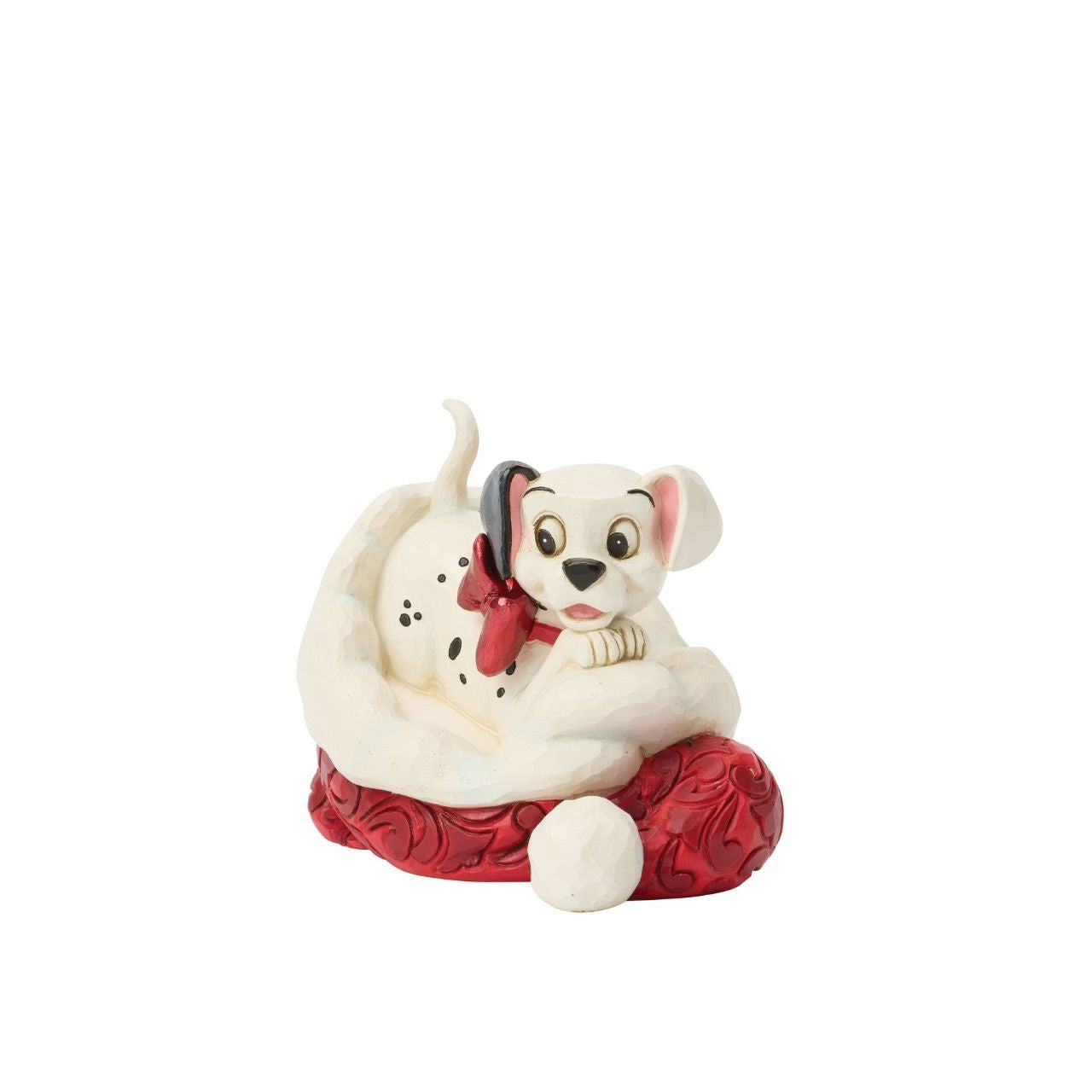 One of Disney's 101 playful dalmatians peeks out from a Santa hat in this adorable Jim Shore.