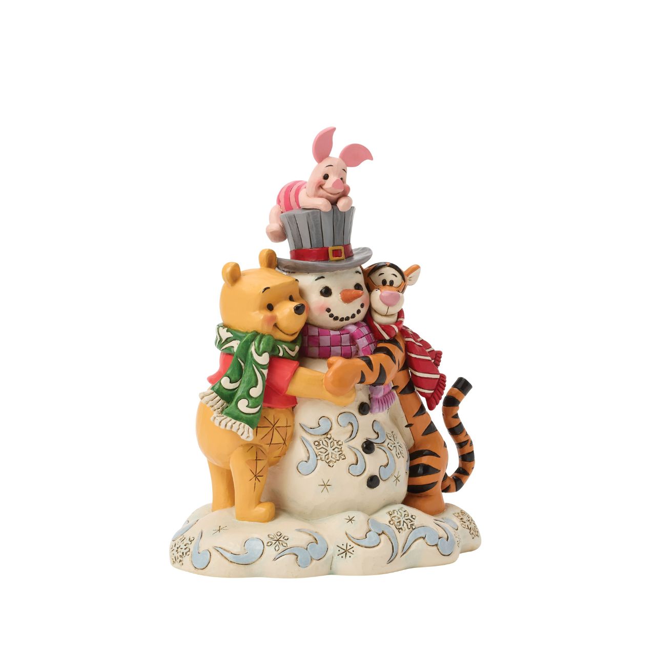 Pooh, Tiger, and Piglet build winter magic together in this cosy Jim Shore design. With bright scarves, rosy cheeks, and a jolly snowman, the scene captures the charm of snowy adventures and the sweetness of friendship with Jim Shore's iconic style.