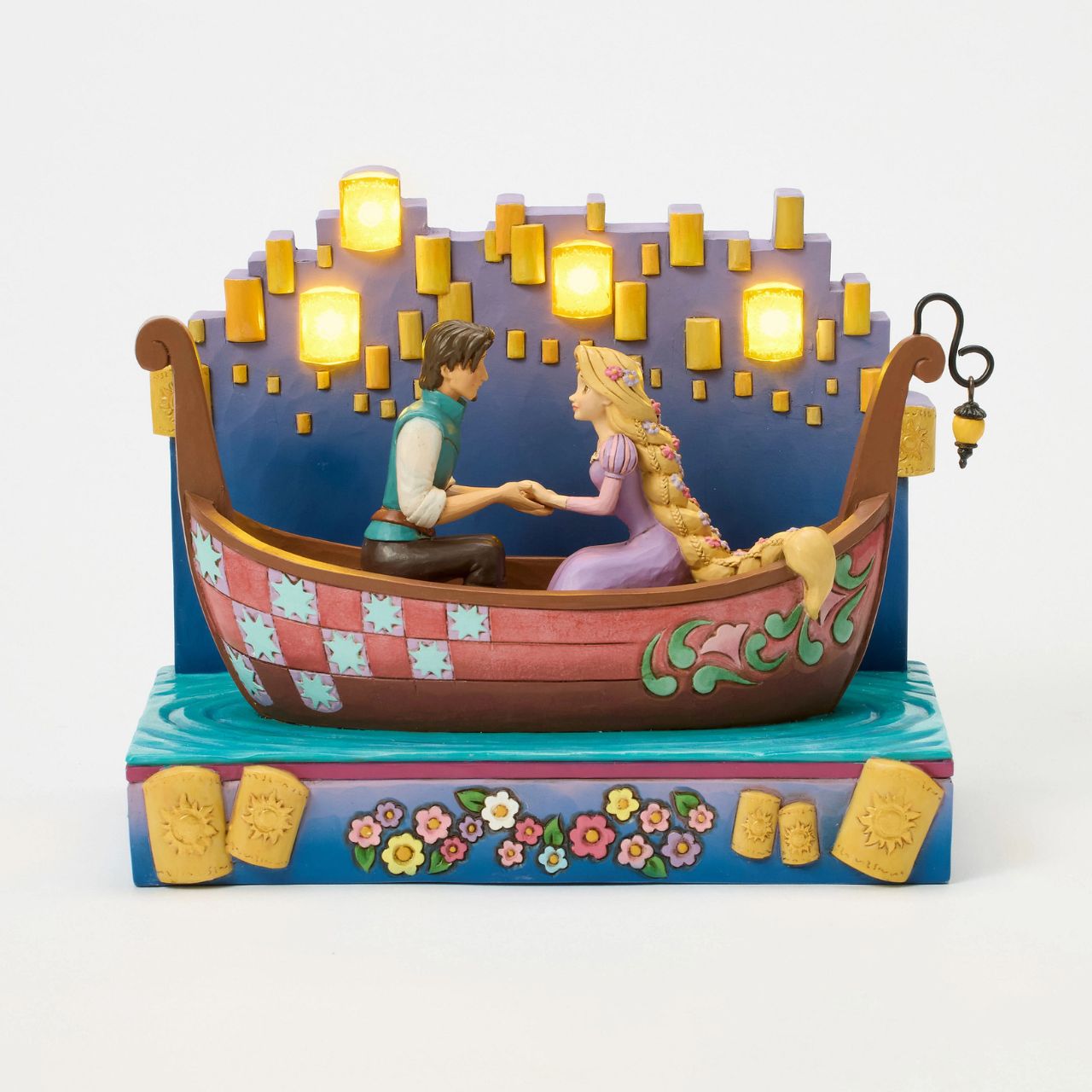 In this beautiful Jim Shore design, Rapunzel and Flynn Rider share a romantic boat ride through glowing LED floating lanterns. Capturing the enchantment, Rapunzel's charm shines with flowers in her hair.