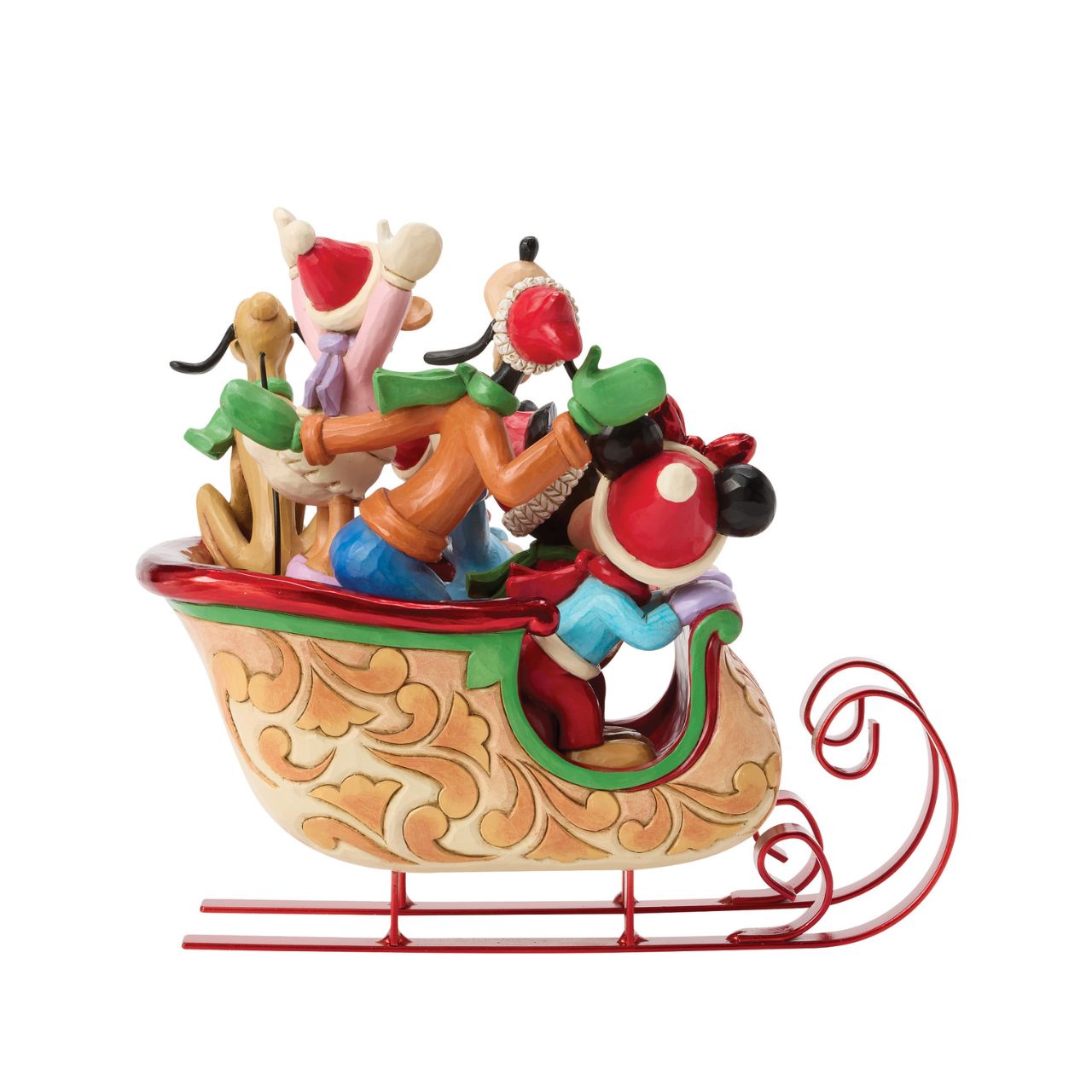 Celebrate the season with Jim Shore's enchanting Christmas sleigh ride featuring Mickey, Minnie, Donald, Daisy, Goofy, and Pluto bundled together in a beautifully crafted sleigh. Decorated with vibrant rosemaling patterns and gleaming metal runners.