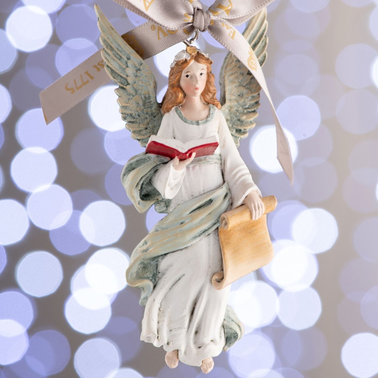 Angel Christmas Hanging Ornament by Aynsley  Elevate your holiday decor to new heights with the enchanting Aynsley Christmas Hanging Ornaments collection. Each ornament is meticulously crafted to bring a touch of festive magic to your home, making it the perfect addition to your Christmas tree or any festive display.