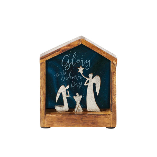 Artist, Wendy Wiinanen, crafts memorable and miniature traditional Christmas moments from mango wood and aluminium. This enchanting display places two angels in a wooden stable peering over a cradle.