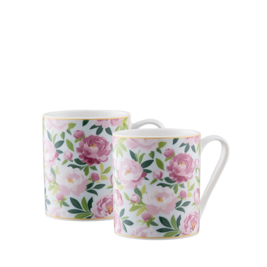 The Pink Peony Mugs Pair captures the beauty of soft blush florals on fine china, adding a delicate charm to tea or coffee moments. Presented in elegant gift packaging, they make a thoughtful gift or a lovely addition to your home.