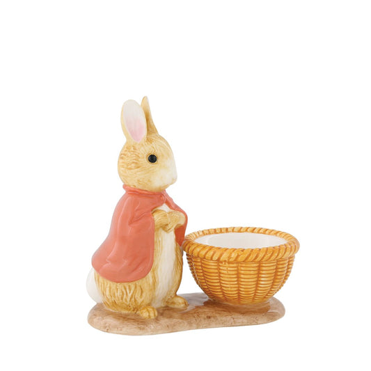 Peter Rabbit Flopsy Egg Cup  Serve your morning eggs in style with our unique and charming Flopsy egg cup, because regular egg cups aren't all they're cracked up to be... This beautiful Beatrix Potter egg cup has been made from sturdy ceramic and makes the ideal. collector's piece or gift. We recommend you use large eggs to feel the true benefit, or why not fill with mini chocolate eggs for a sweet easter gift.