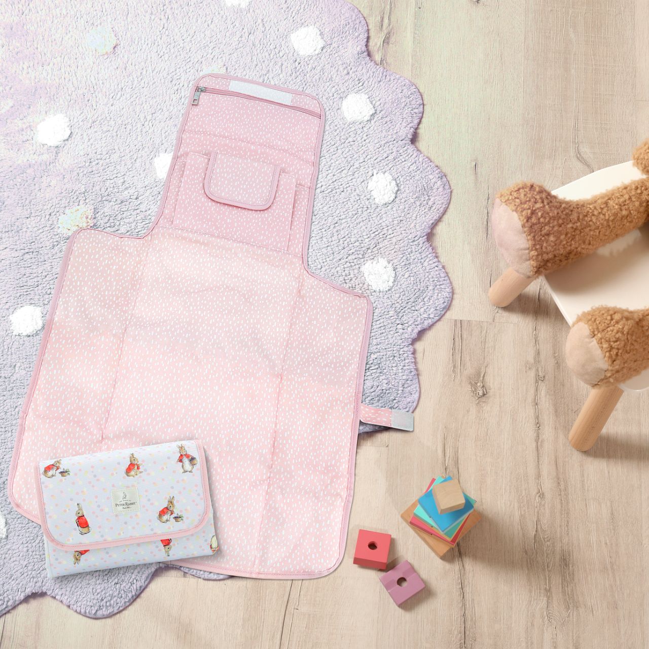 This fold out Peter Rabbit changing mat is both adorable, practical and essential for quick trips out with your baby. The changing mat has been designed to take you seconds to unwrap and use when you are on the go, helping to spend more time on the things you love doing with your baby.