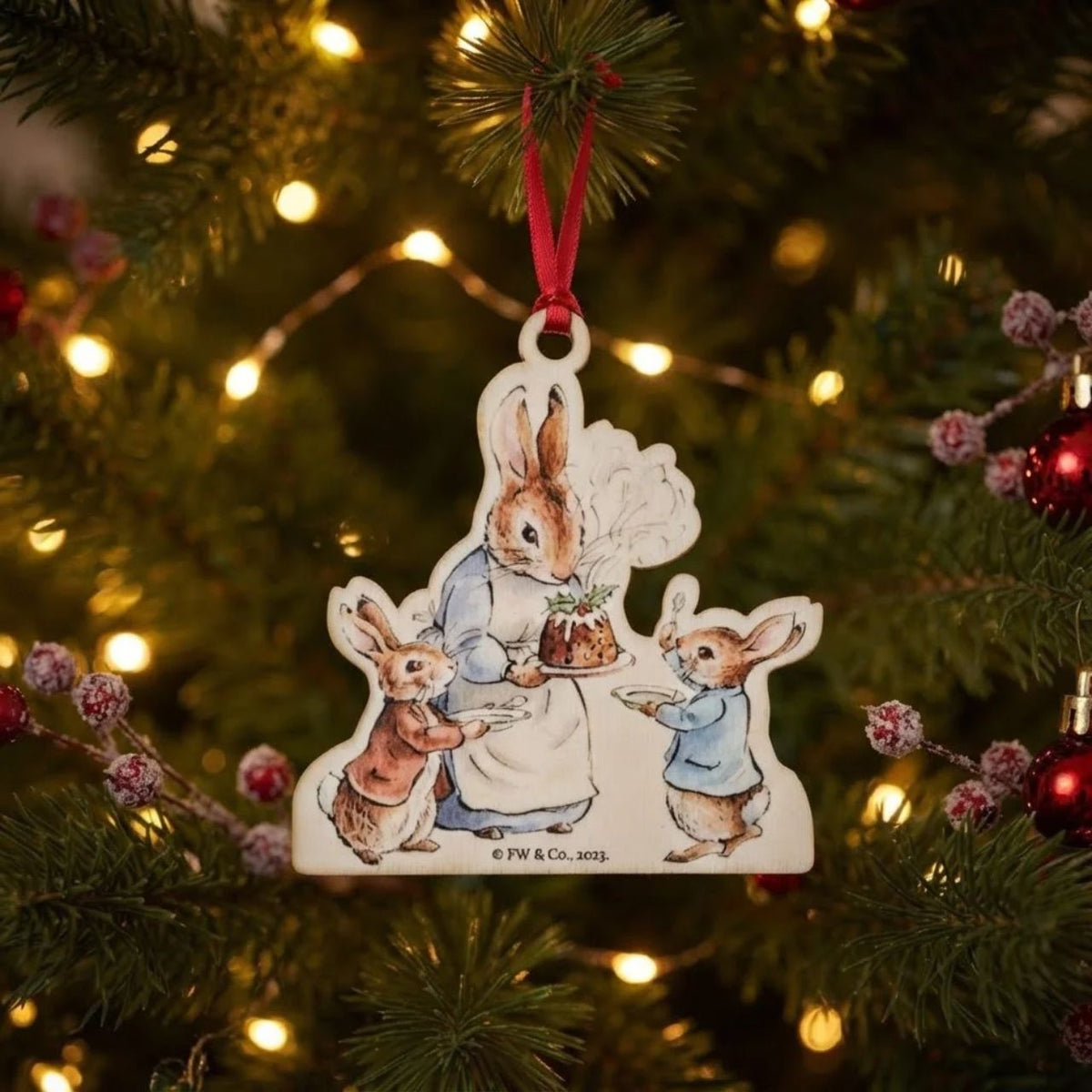 This Mrs. Rabbit with a Christmas Pudding Wooden Hanging Ornament would make a truly unique gift or self-purchase.