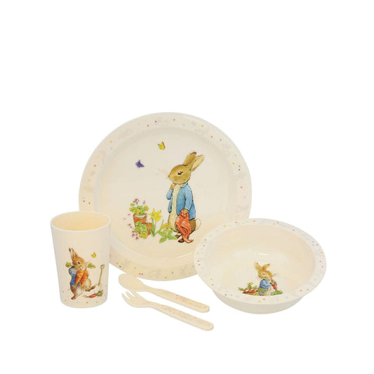 Bring the magic of Beatrix Potter to mealtimes with this brand-new Peter Rabbit 5-piece dinner set. This beautiful set includes a beaker, plate, bowl, spoon, and fork, all featuring classic Peter Rabbit illustrations on a gender-neutral cream base.