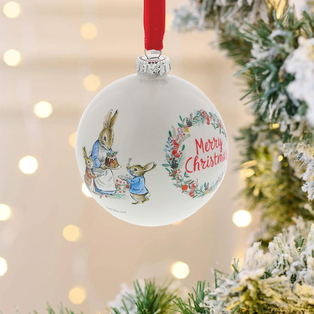 Beatrix Potter Peter Rabbit Christmas Bauble  A beautiful glass Peter Rabbit Bauble that makes a treasured keepsake all year round. The artwork for each product is taken from the original illustrations from the Beatrix Potter stories, helping bring each character to life.