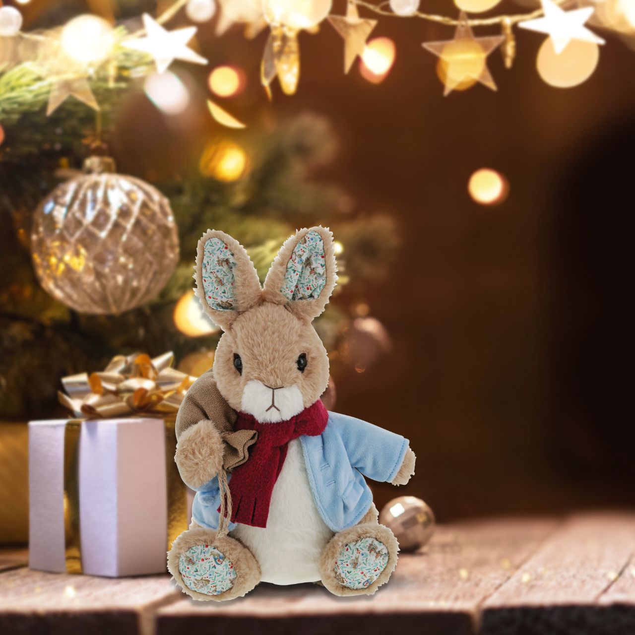 Peter Rabbit Christmas Large  We've added a touch of Christmas sparkle to our Peter Rabbit soft you. This Peter Rabbit will make the perfect keepsake for anyone who loves Christmas and the festivities it brings. A gift that isn't just for little ones, but for grownups too. Your new Peter Rabbit friend will arrive with a cute cosy scarf and festive sack.