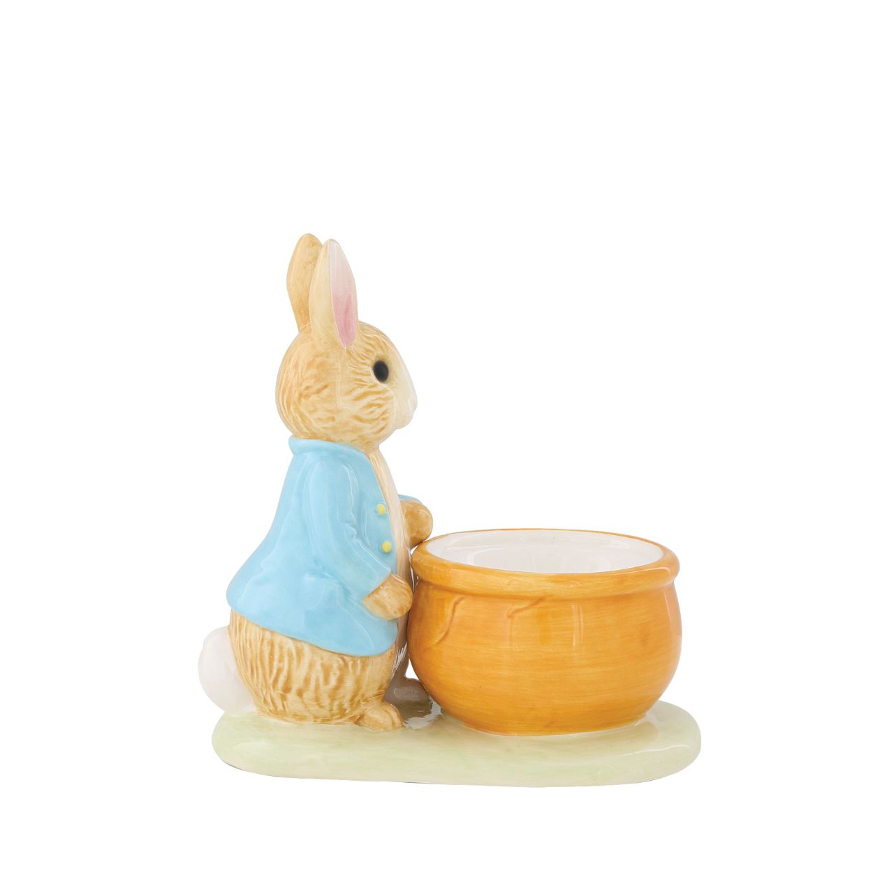 Peter Rabbit Egg Cup  Serve your morning eggs in style with our unique and charming Peter Rabbit egg cup, because regular egg cups aren't all they're cracked up to be...This beautiful Beatrix Potter egg cup has been made from sturdy ceramic and makes the ideal collector's piece or gift. We recommend you use large eggs to feel the true benefit, or why not fill with mini chocolate eggs for a sweet easter gift.