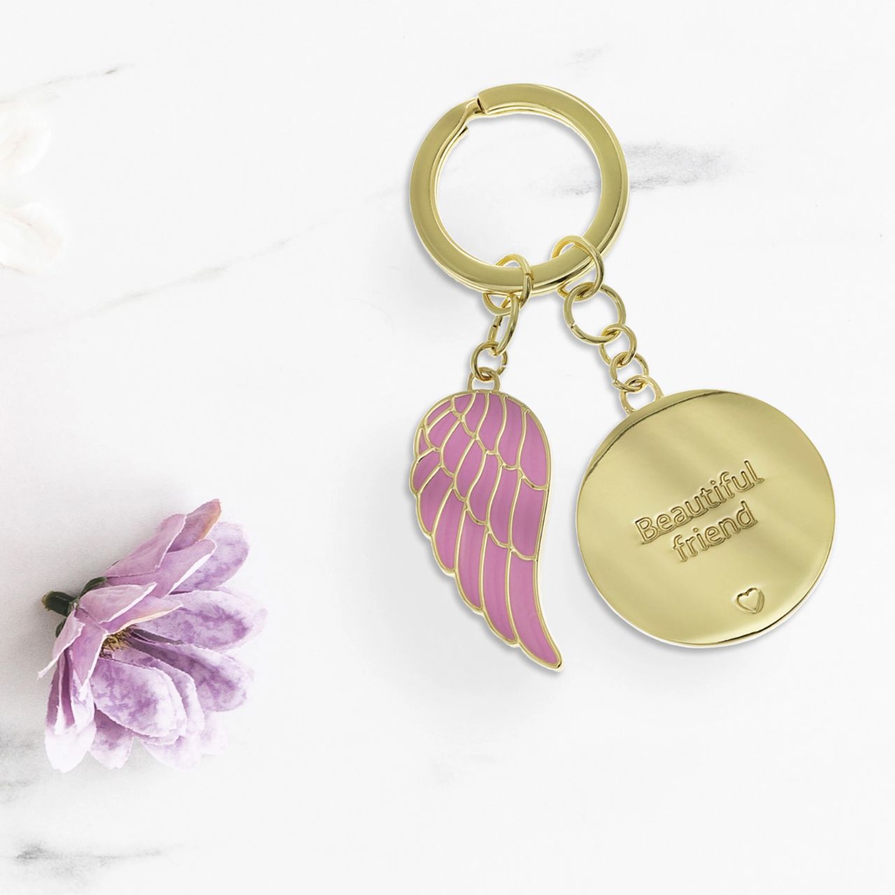 "Beautiful Friend" keychain: Crafted with luxurious leather and sleek metal, elegantly packaged in a gold embossed gift box. This sophisticated accessory symbolizes enduring bonds, a perfect gift celebrating cherished friendships in style.