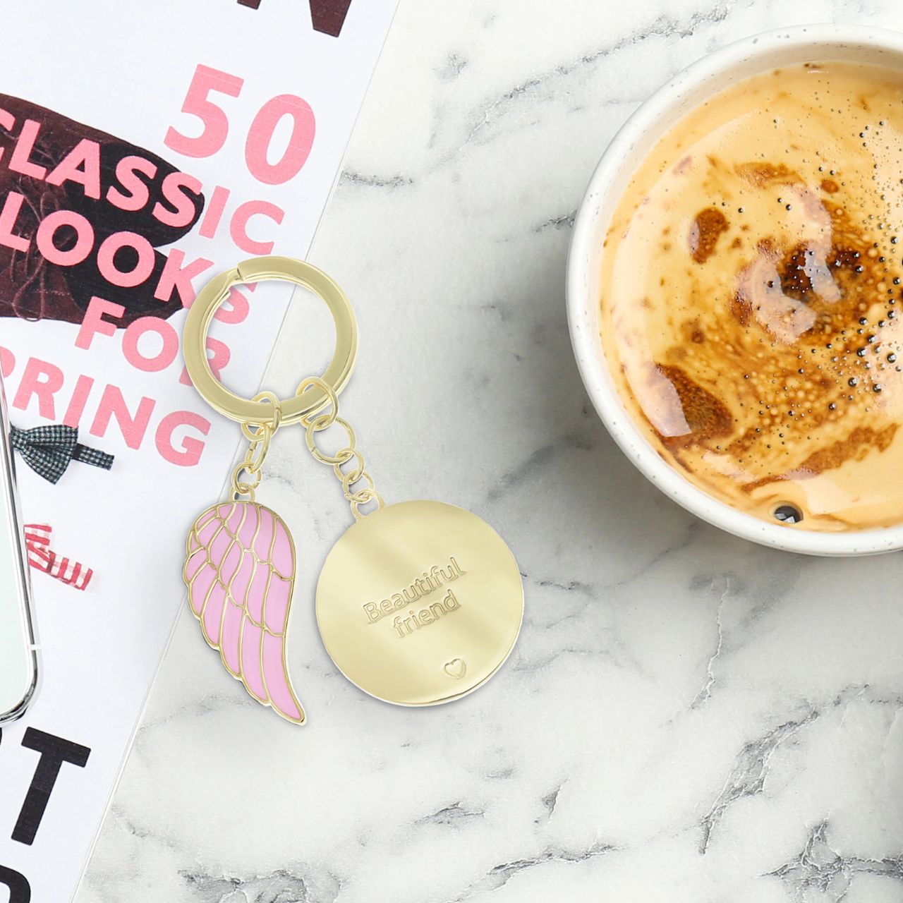 "Beautiful Friend" keychain: Crafted with luxurious leather and sleek metal, elegantly packaged in a gold embossed gift box. This sophisticated accessory symbolizes enduring bonds, a perfect gift celebrating cherished friendships in style.