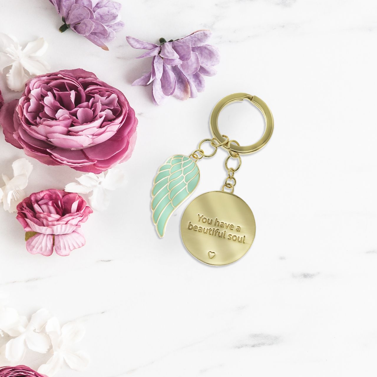 Introducing the 'Beautiful Soul' Key Chain by You are an Angel. An exquisite token gift nestled within a stunning gold embossed gift box. A timeless tribute celebrating inner beauty and kindness, a cherished keepsake to honour the profound depth of a special soul.