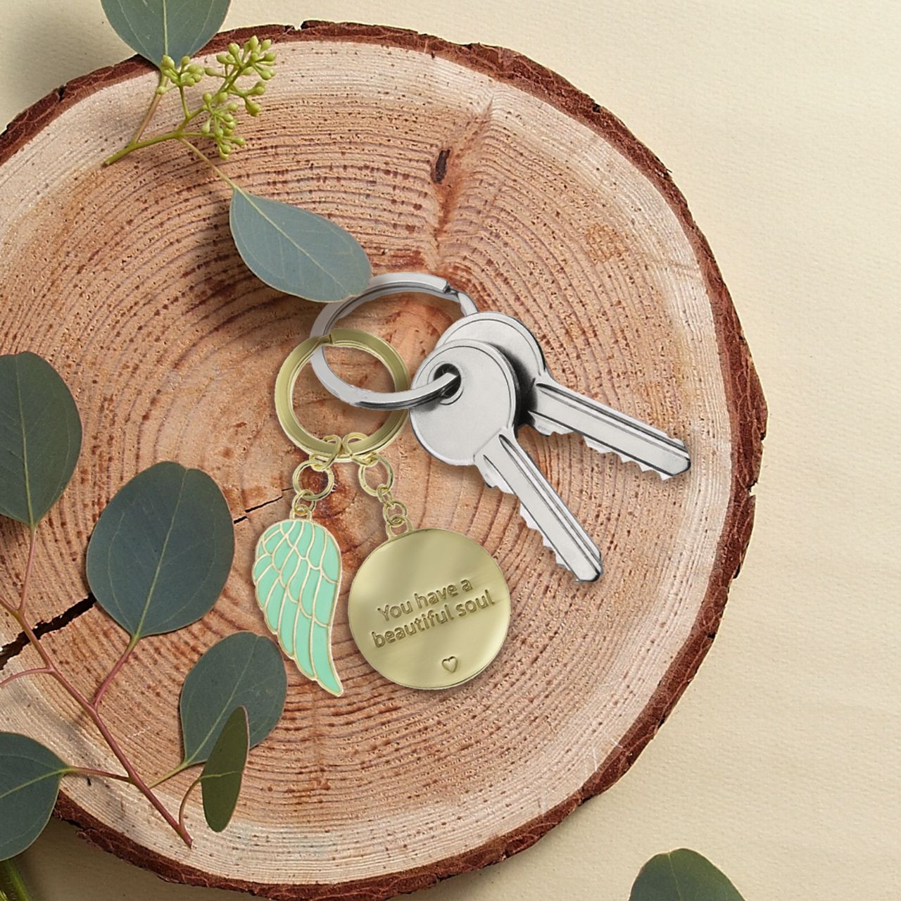 Introducing the 'Beautiful Soul' Key Chain by You are an Angel. An exquisite token gift nestled within a stunning gold embossed gift box. A timeless tribute celebrating inner beauty and kindness, a cherished keepsake to honour the profound depth of a special soul.