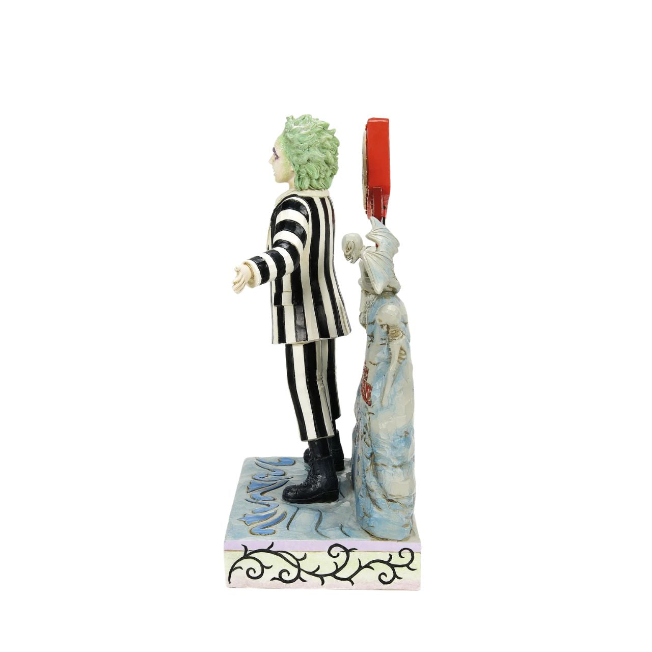 Beetlejuice, Beetlejuice, Beetlejuice... He's here. The iconic bio-exorcist from the 1988 Tim Burton film has arrived and this time, he has a Jim Shore twist. Crafted from high quality cast stone and hand-painted, this light up figurine features the main (dead) man himself, atop his grave with an illuminated "Vegas" style LED sign letting all know who he is.