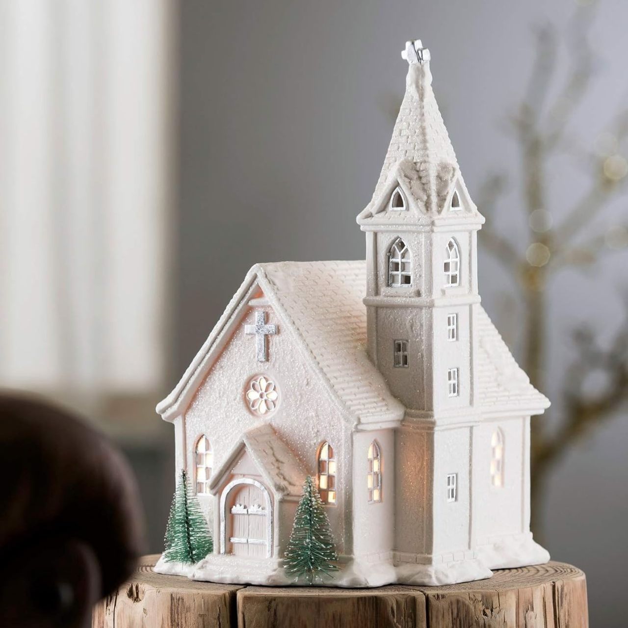 Christmas Church Lamp by Belleek Living  This Church Lamp is an exciting piece from Belleek Living. Shaped like a church the detail that this piece brings is exceptional. Timely pierced holes allow subtle light to shine through letting it reinact a Christmas scene of people in the church at the most special time of year.