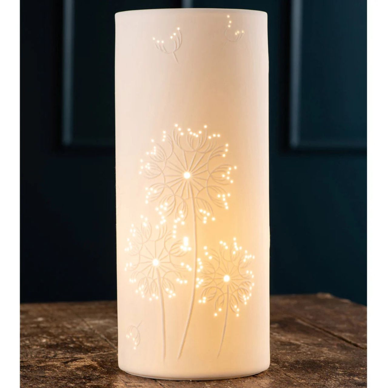Beautifully pierced ceramic luminaires create soft mood lighting for your living space. This cylinder shaped lamp would suit any décor as it displays intricate designs that have been carefully pierced to provide low mood lighting. Makes a perfect gift.