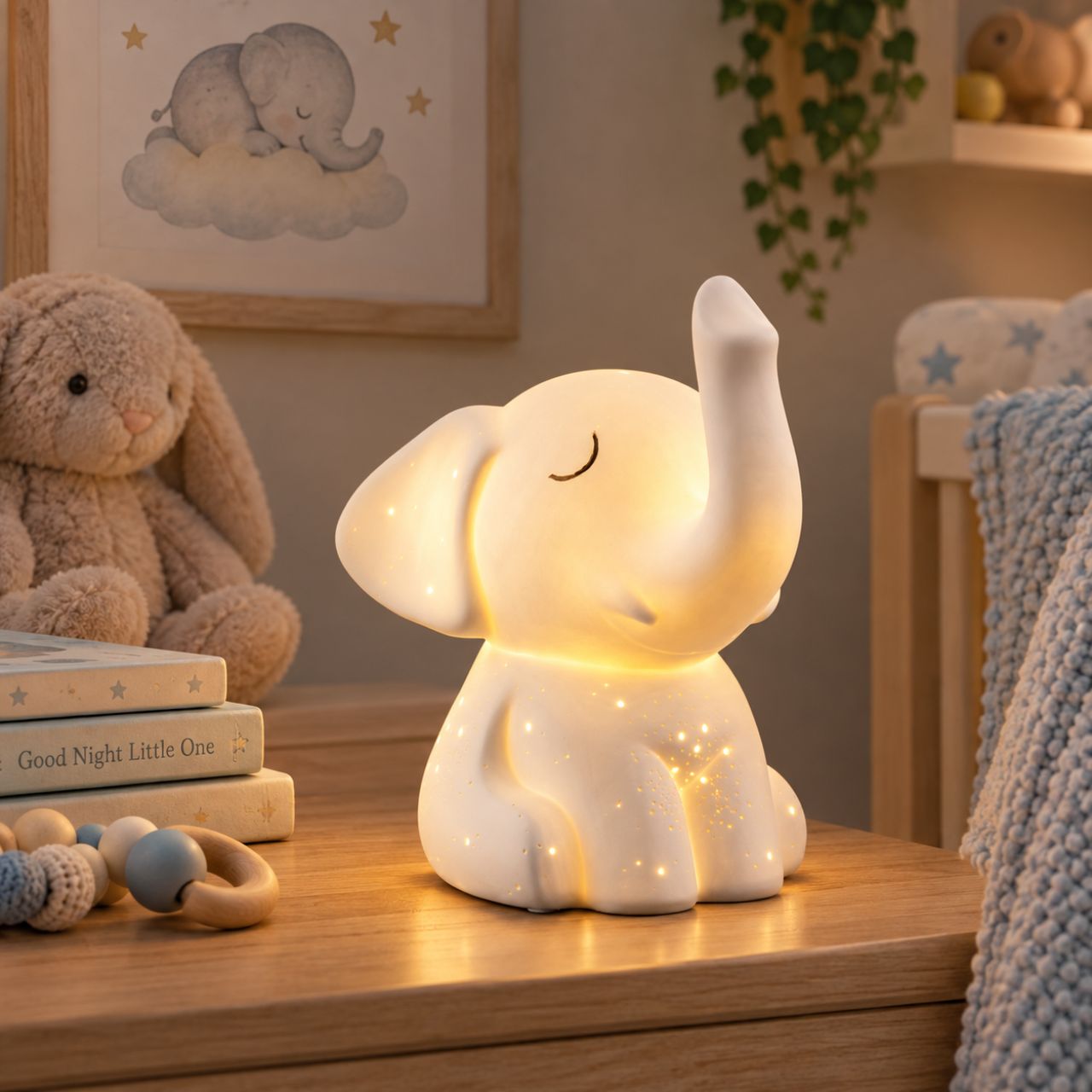 This charming elephant shaped luminaire features a raised trunk, a happy little face and pierced with a starlight pattern. When lit the porcelain body illuminates emitting a soft gentle glow highlighting all the details in this charming lamp, perfect for any animal lover.