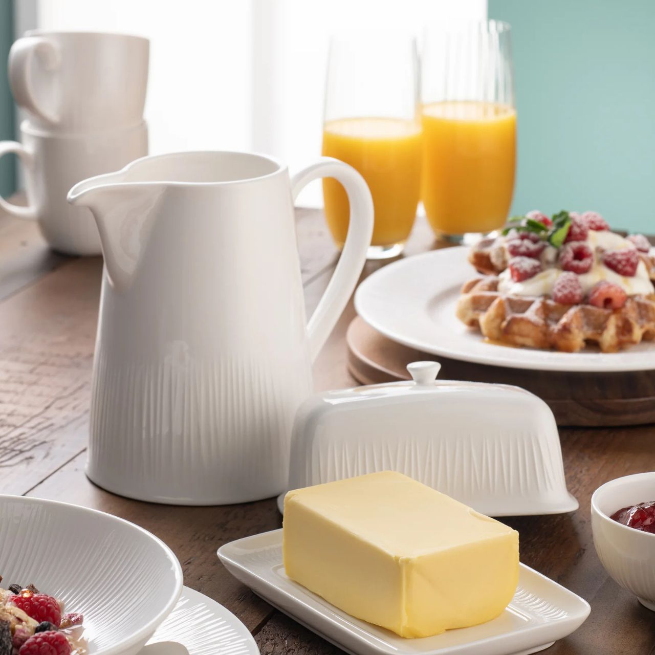 The Erne tableware collection is crafted from crisp white porcelain, featuring a subtle linear pattern inspired by the banks of the Lough Erne.