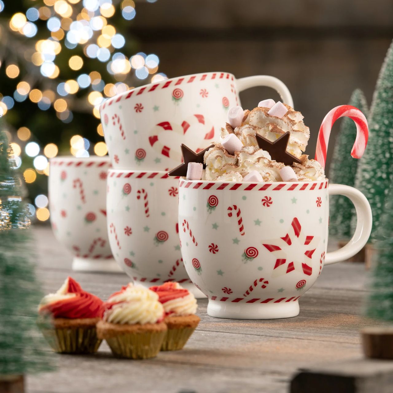 These large capacity footed mugs feature a playful pattern of festive sweets with candy cane stripe details. Ideal for decadent hot chocolates or your favourite hot drinks during the festive season. Beautifully boxed in a matching gift box these mugs would make for an ideal gift.